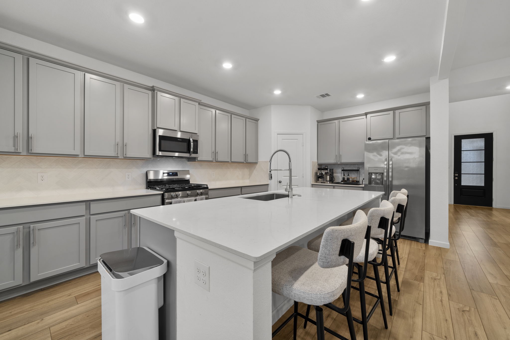 3704 Field Coast Lane Rosenberg, TX 77469 - Photo 7 of 49 Kitchen island overlooking dining and living areas