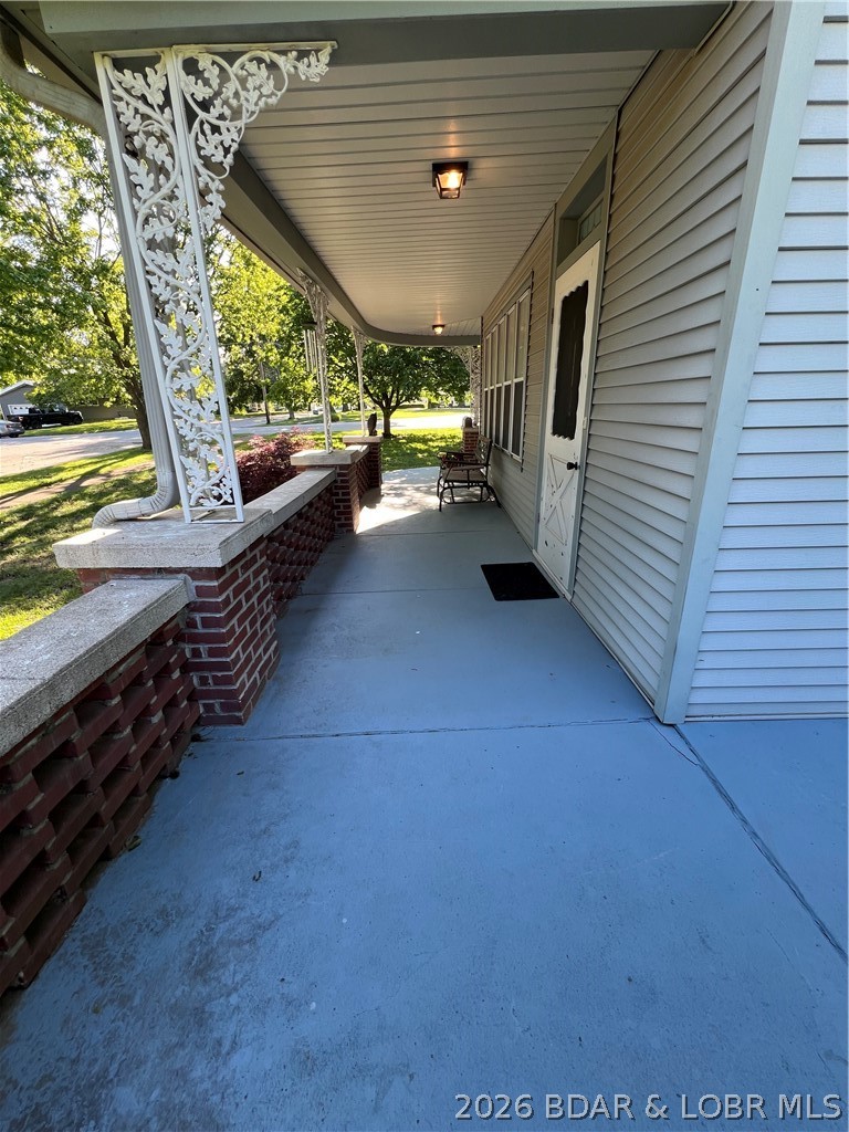 601 East Newton Street Eldon, MO 65026 - Photo 2 of 61 the wraparound porch feels pulled from a simpler e