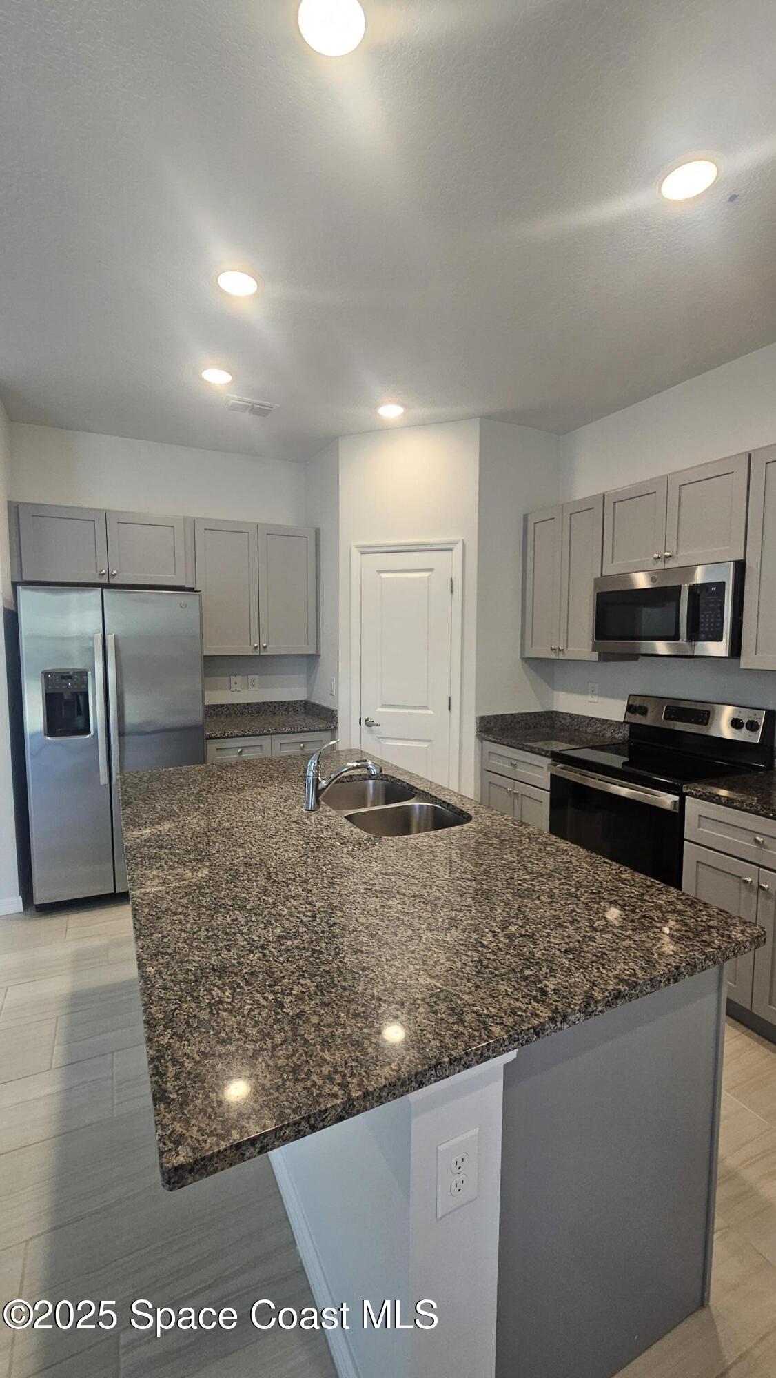 450 Tunis Road Southwest Palm Bay, FL 32908 - Photo 3 of 22 Tunis Kitchen 2