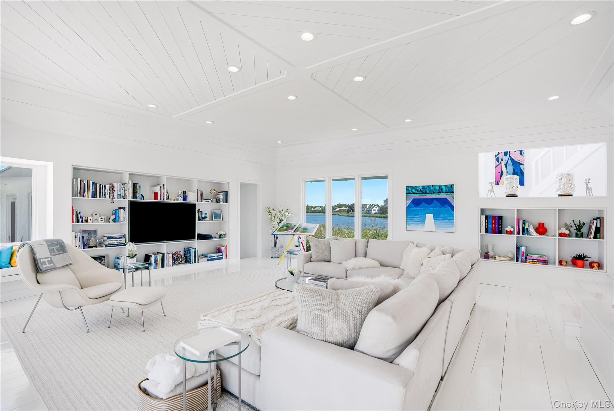 64 West End Road East Hampton, NY 11937 - Photo 11 of 33 a living room with furniture and a flat screen tv
