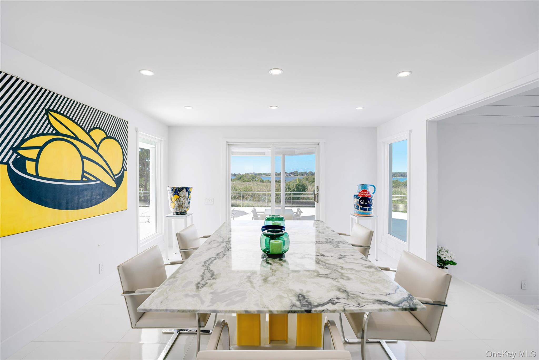64 West End Road East Hampton, NY 11937 - Photo 12 of 33 a living room with furniture and a large window