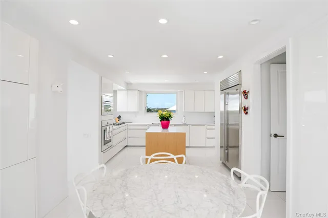 a kitchen with a stove and workspace