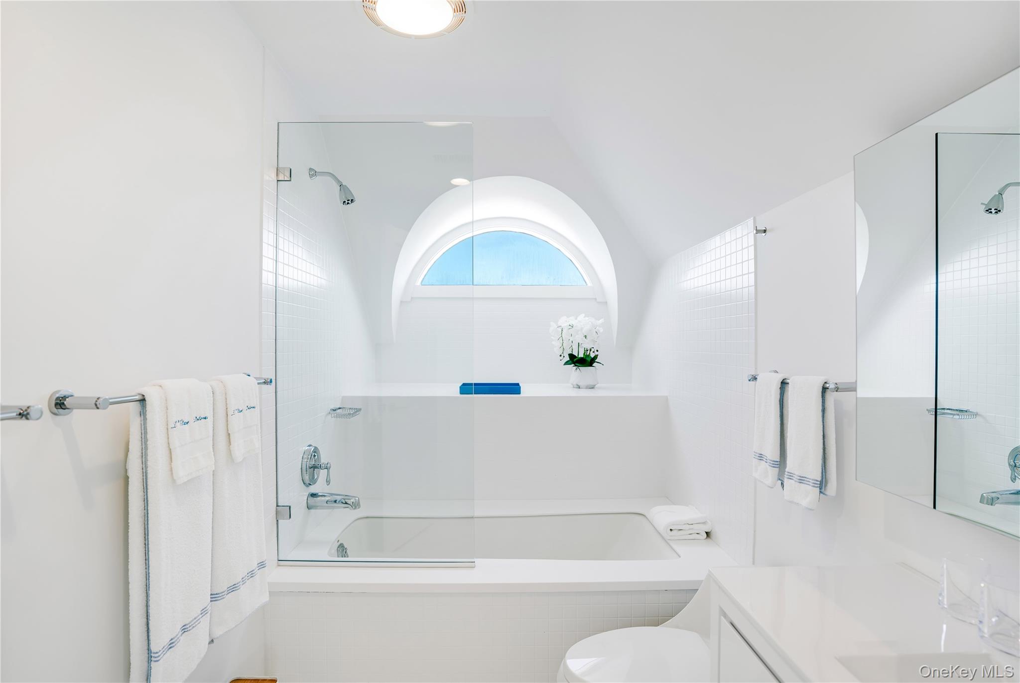 64 West End Road East Hampton, NY 11937 - Photo 19 of 33 a bathroom with a tub and shower