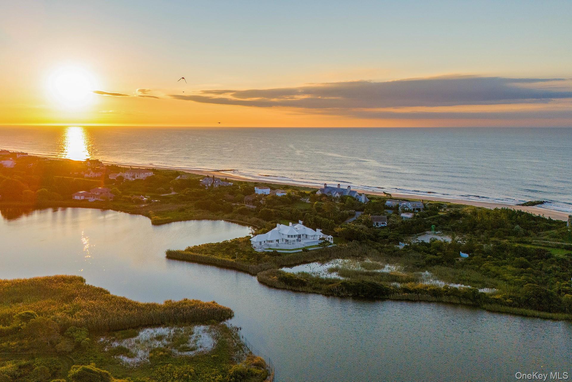 64 West End Road East Hampton, NY 11937 - Photo 2 of 33 a view of an ocean and a mountain