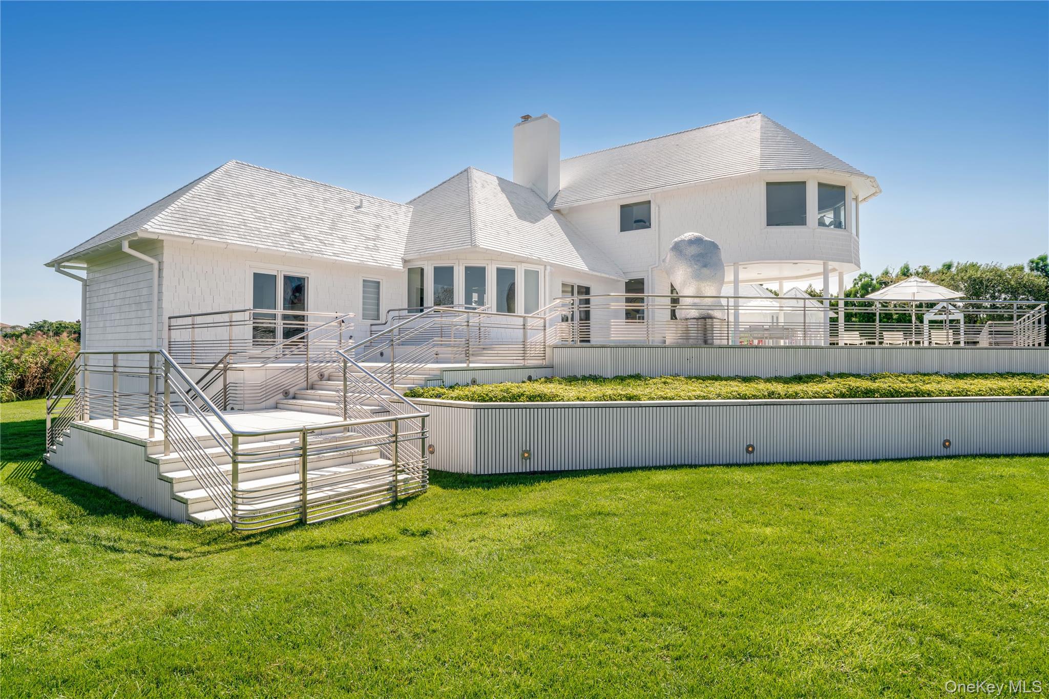 64 West End Road East Hampton, NY 11937 - Photo 24 of 33 a front view of house with swimming pool