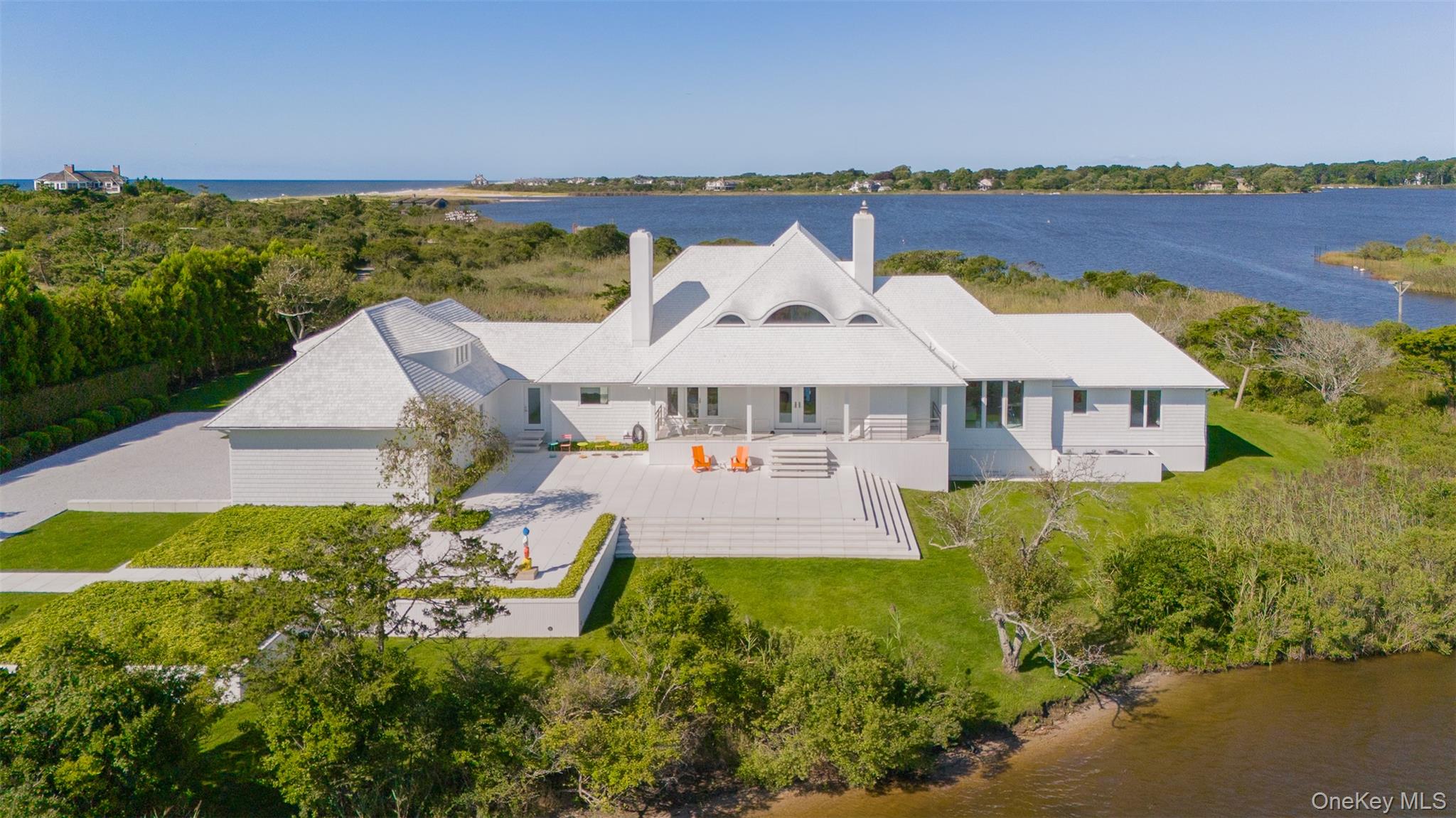 64 West End Road East Hampton, NY 11937 - Photo 5 of 33 an aerial view of a house with a garden and lake view