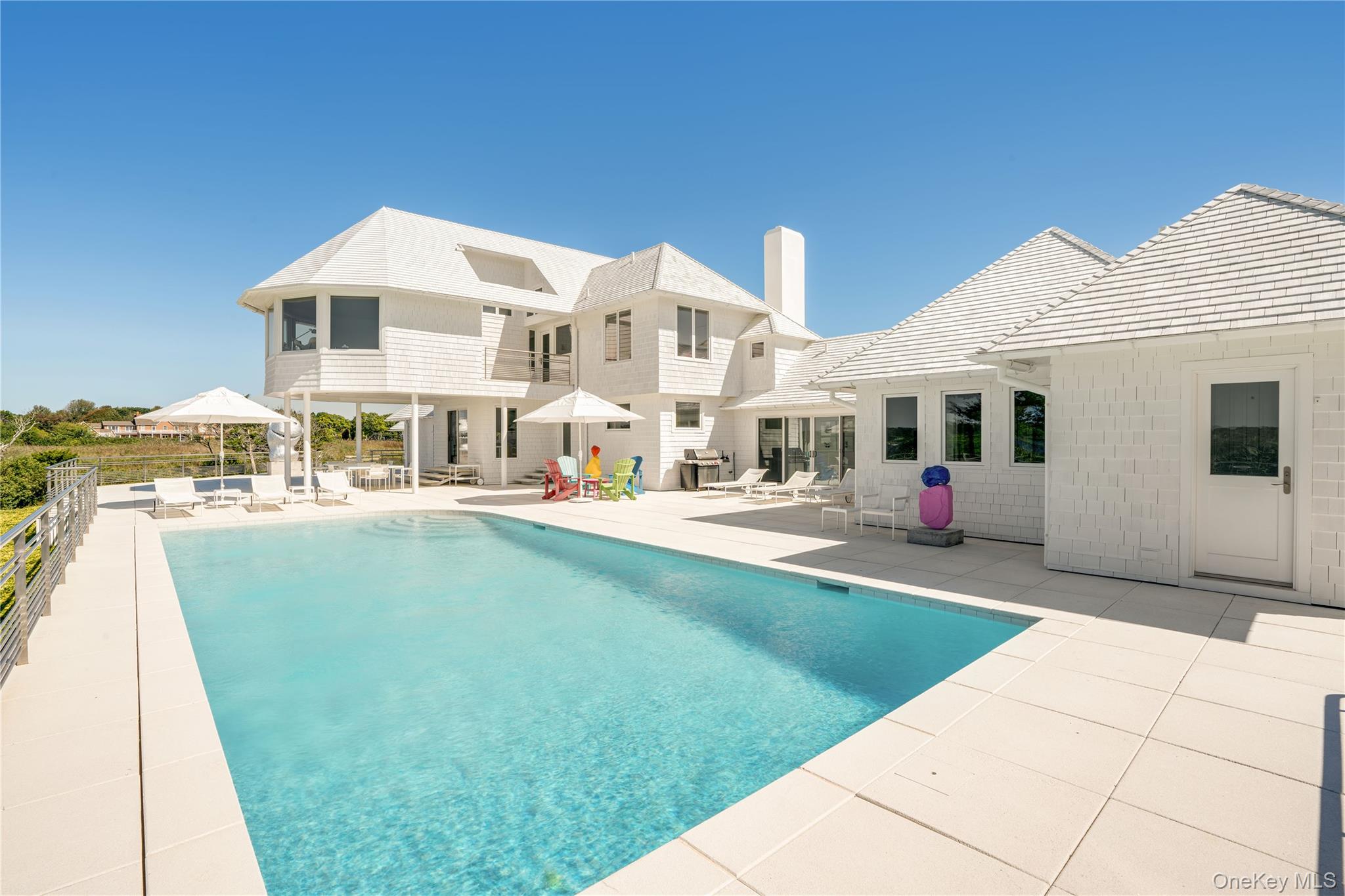 64 West End Road East Hampton, NY 11937 - Photo 6 of 33 a front view of a house with a yard