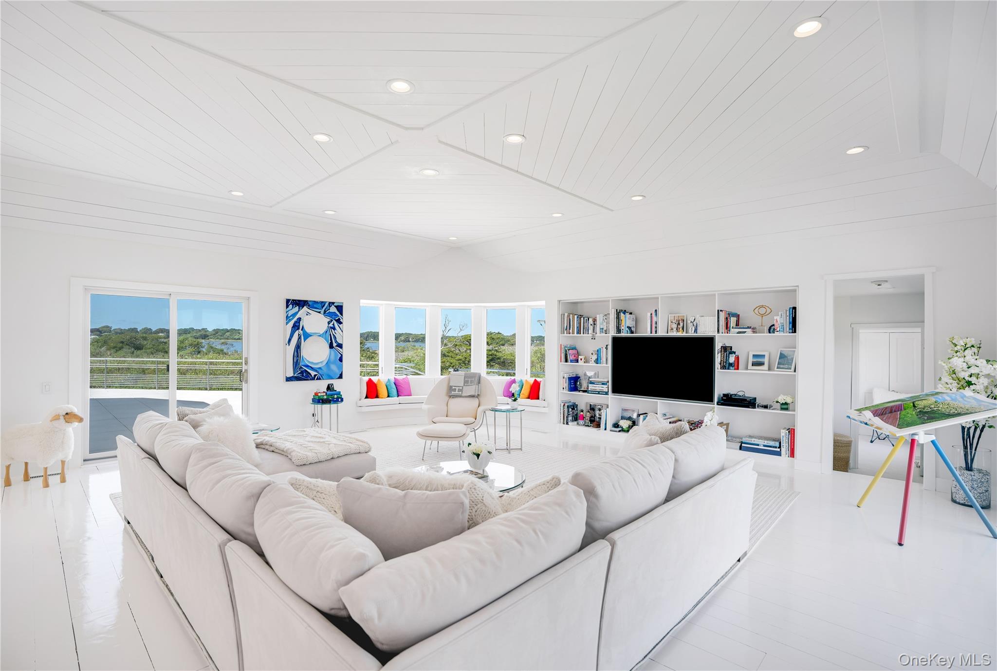 64 West End Road East Hampton, NY 11937 - Photo 9 of 33 a living room with furniture and a flat screen tv