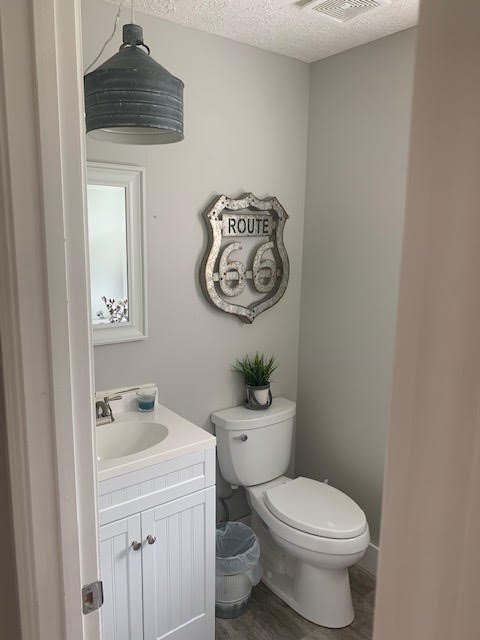 4002 Timber Ridge Court Mount Juliet, TN 37122 - Photo 13 of 37 a white toilet sitting next to a bathroom sink