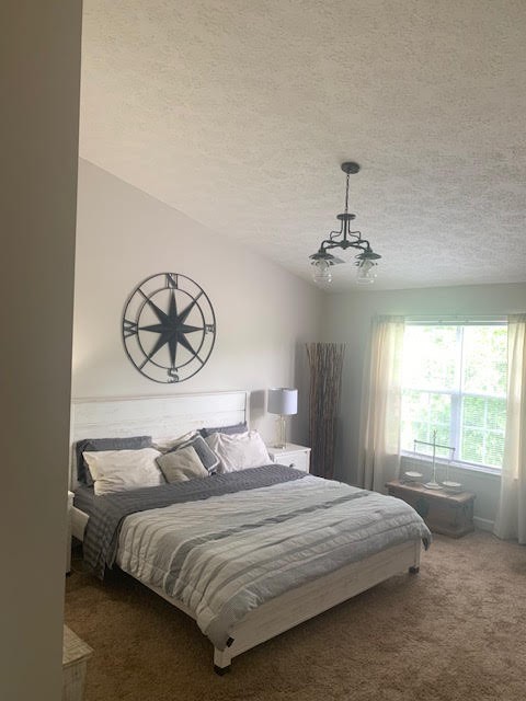 4002 Timber Ridge Court Mount Juliet, TN 37122 - Photo 14 of 37 a bedroom with a bed and a window