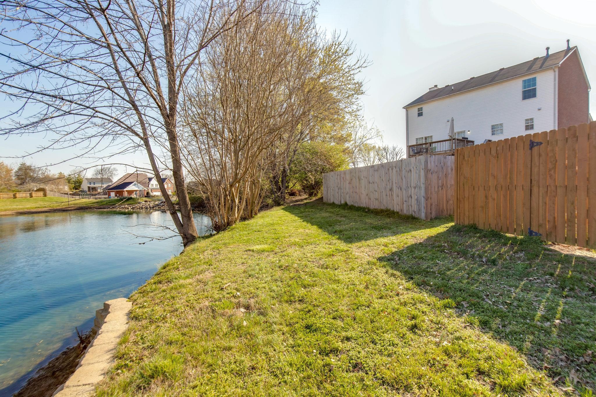 4002 Timber Ridge Court Mount Juliet, TN 37122 - Photo 32 of 37 a view of a backyard with wooden fence