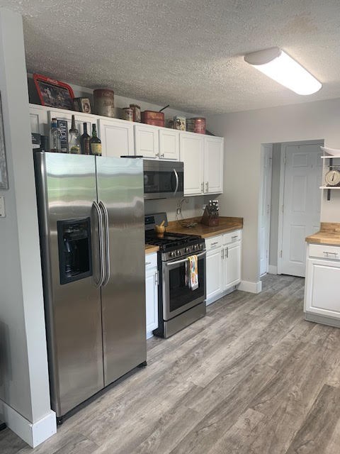 4002 Timber Ridge Court Mount Juliet, TN 37122 - Photo 9 of 37 a kitchen with stainless steel appliances granite countertop a refrigerator and a stove