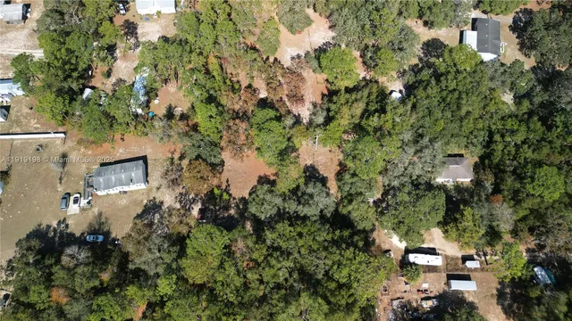 a view of a house with a tree