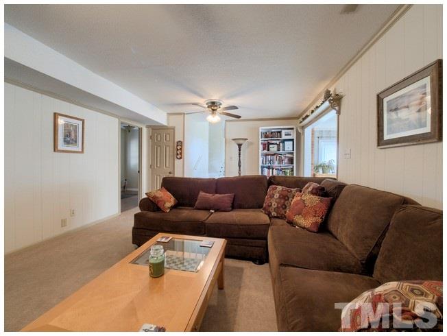 908 Orange Factory Road Bahama, NC 27503 - Photo 12 of 23 a living room with furniture and a couch