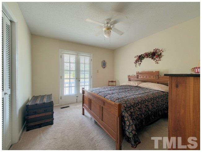 908 Orange Factory Road Bahama, NC 27503 - Photo 16 of 23 a bedroom with a bed and window