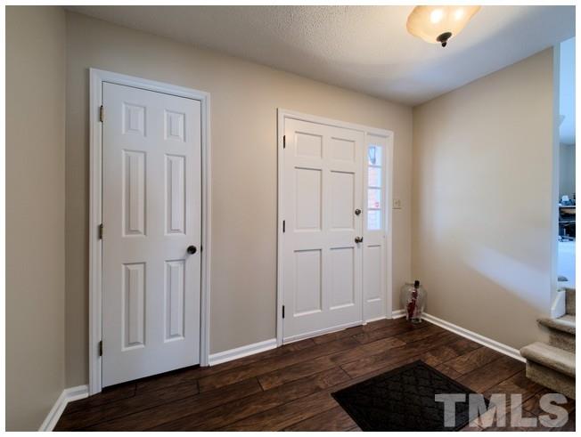 908 Orange Factory Road Bahama, NC 27503 - Photo 3 of 23 a view of a livingroom with wooden floor and closet
