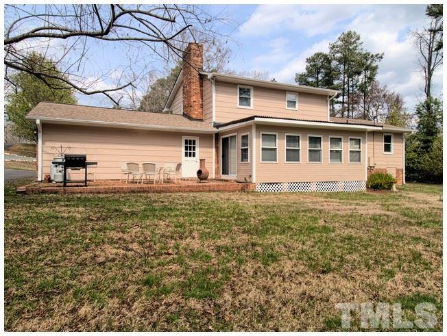 908 Orange Factory Road Bahama, NC 27503 - Photo 21 of 23 front view of a house with a yard