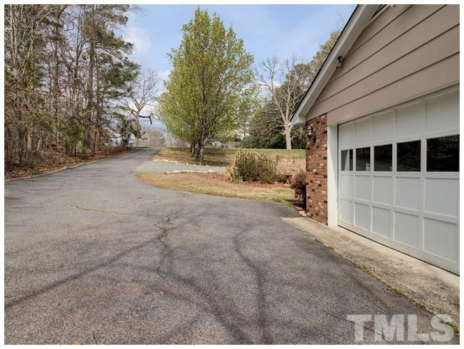 908 Orange Factory Road Bahama, NC 27503 - Photo 22 of 23 a view of back yard of the house