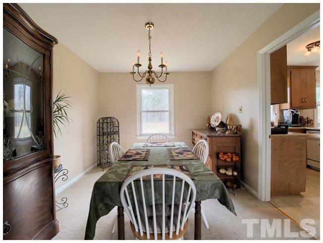 908 Orange Factory Road Bahama, NC 27503 - Photo 7 of 23 a bedroom with furniture and a window