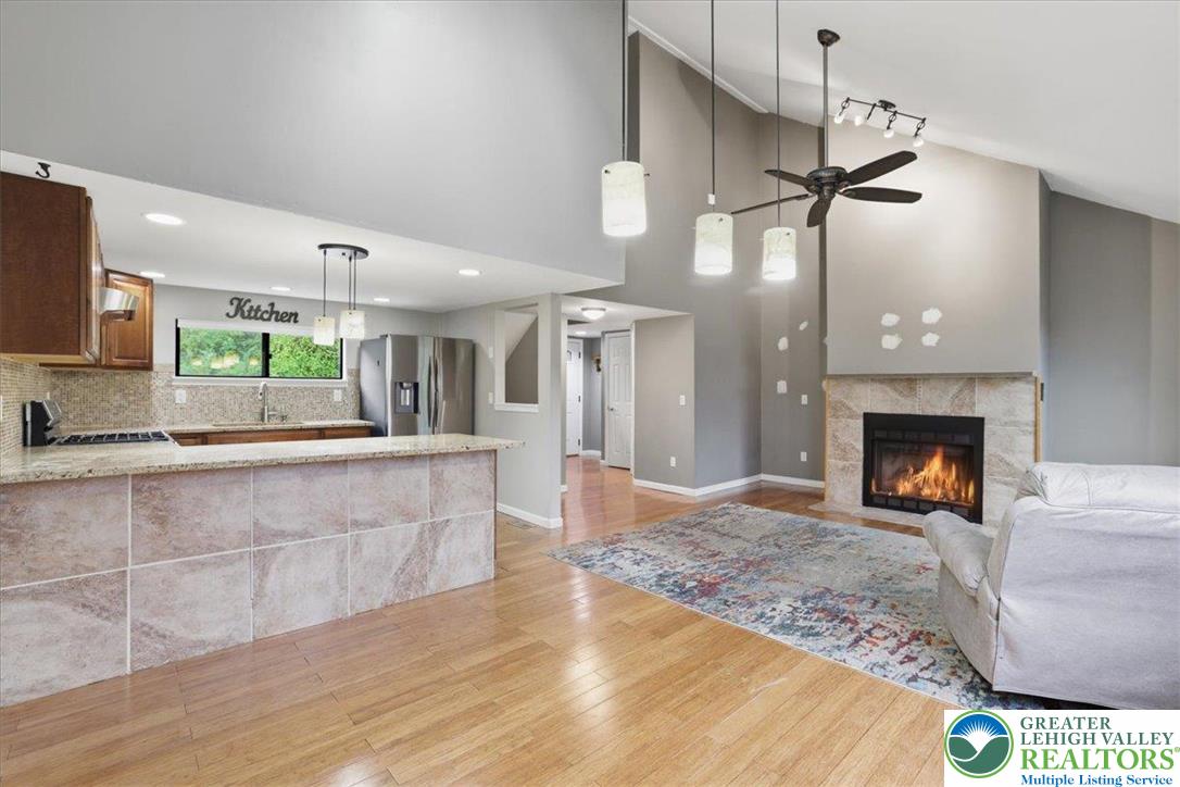 612 Mountain View Way Bushkill, PA 18324 - Photo 5 of 31 a large hall with kitchen view and a fireplace