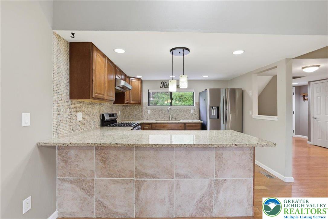 612 Mountain View Way Bushkill, PA 18324 - Photo 6 of 31 a large kitchen with kitchen island a sink stainless steel appliances and cabinets