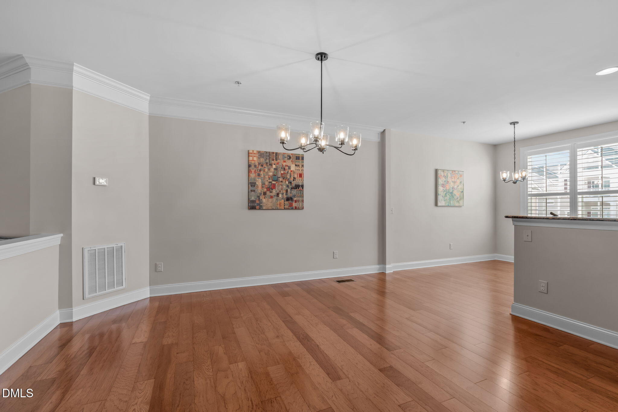 10410 Sablewood Drive, Unit 109 Raleigh, NC 27617 - Photo 14 of 42 a view of a room with wooden floor and exposed radiator