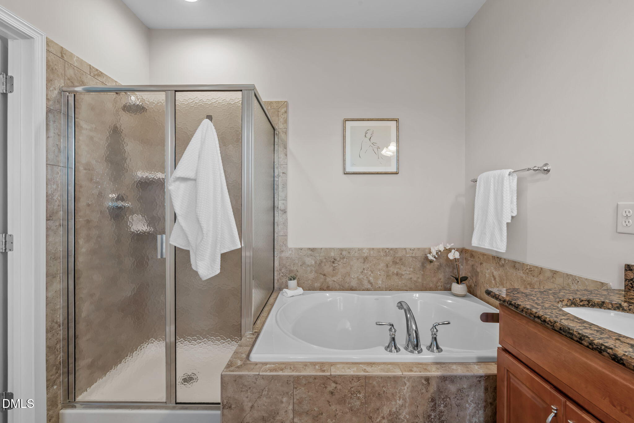 10410 Sablewood Drive, Unit 109 Raleigh, NC 27617 - Photo 21 of 42 a bathroom with a granite countertop sink and a bathtub