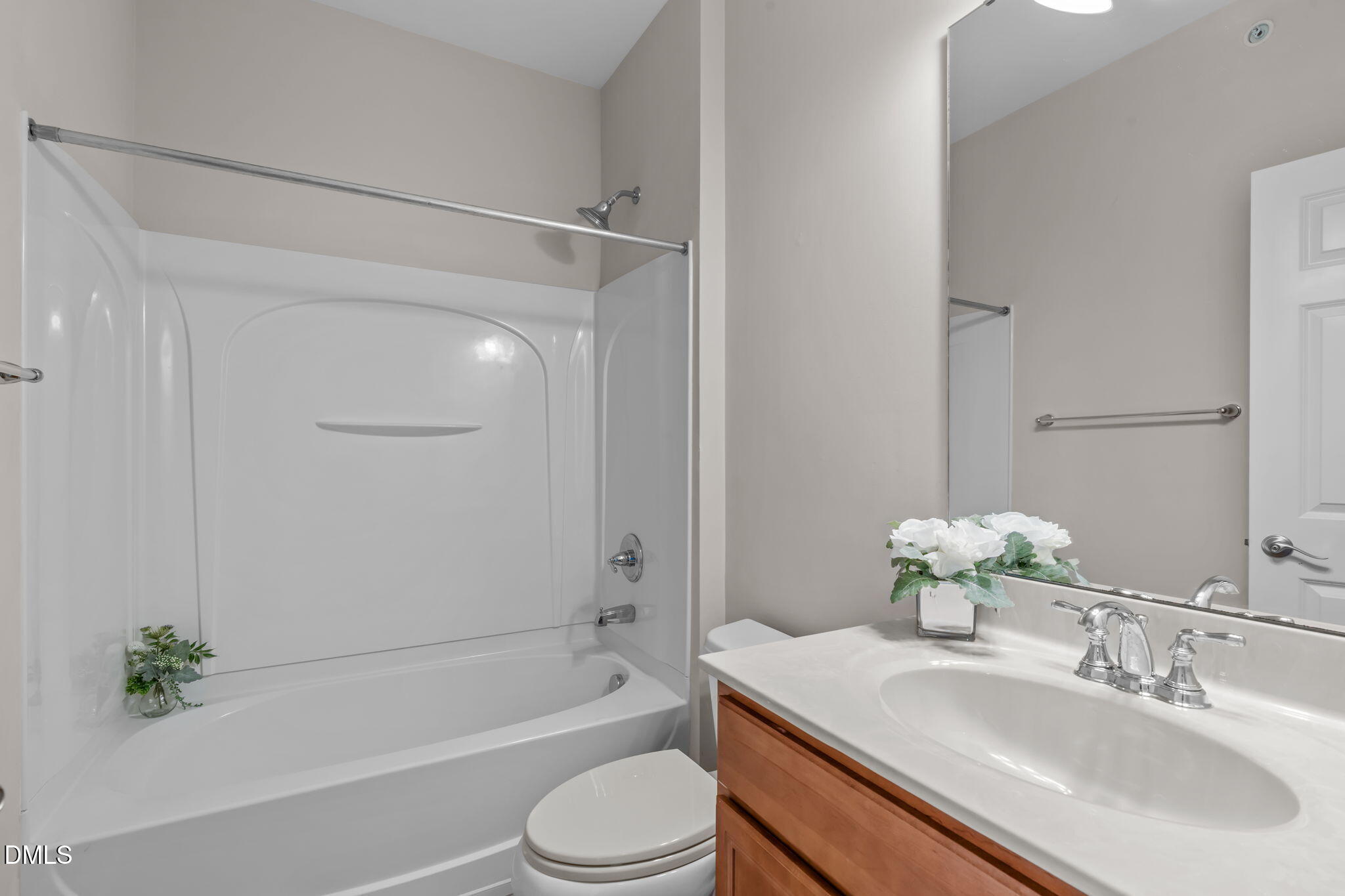 10410 Sablewood Drive, Unit 109 Raleigh, NC 27617 - Photo 27 of 42 a bathroom with a granite countertop sink a toilet and shower