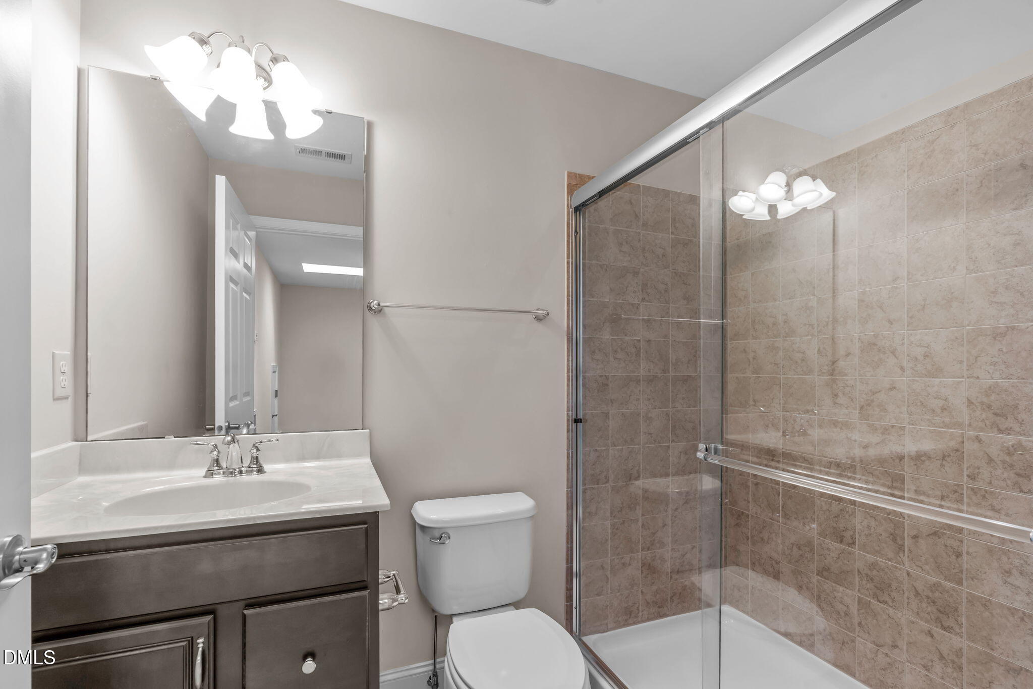 10410 Sablewood Drive, Unit 109 Raleigh, NC 27617 - Photo 33 of 42 a bathroom with a sink toilet and shower
