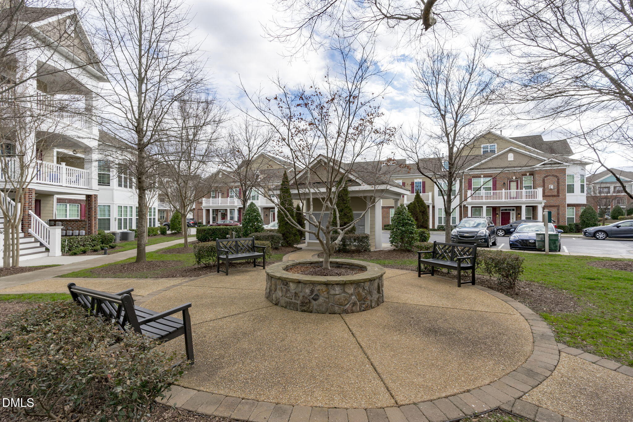 10410 Sablewood Drive, Unit 109 Raleigh, NC 27617 - Photo 36 of 42 a living room with patio furniture and a fire pit