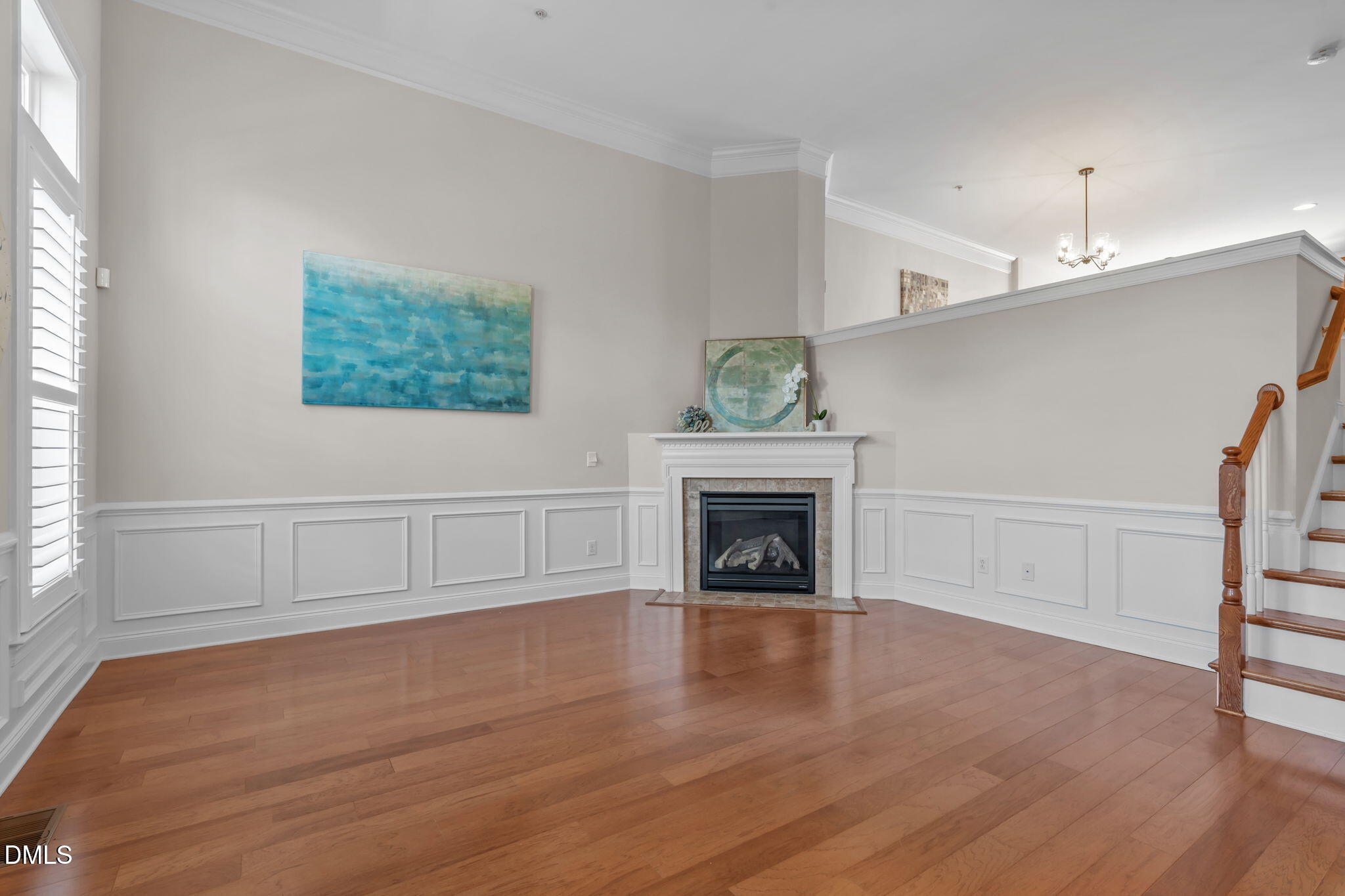 10410 Sablewood Drive, Unit 109 Raleigh, NC 27617 - Photo 6 of 42 a view of an empty room with wooden floor and a window