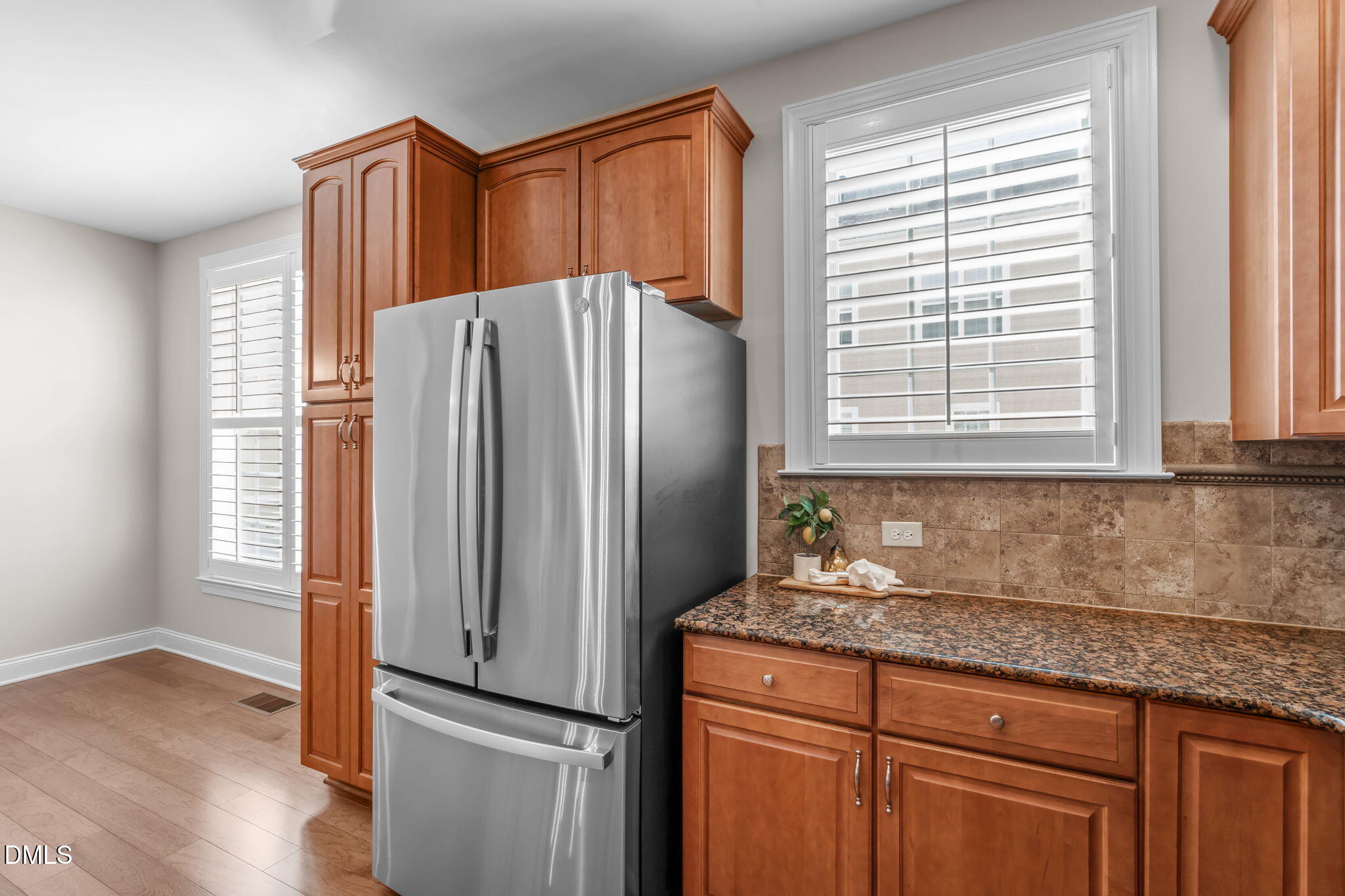 10410 Sablewood Drive, Unit 109 Raleigh, NC 27617 - Photo 10 of 42 a kitchen with granite countertop a refrigerator and a sink