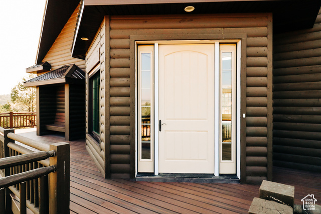985 Russell Road Hatch, UT 84735 - Photo 3 of 30 Entrance to property with faux log siding and a deck