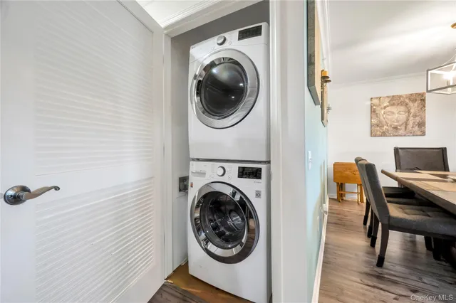 a view of a hallway with washer and dryer