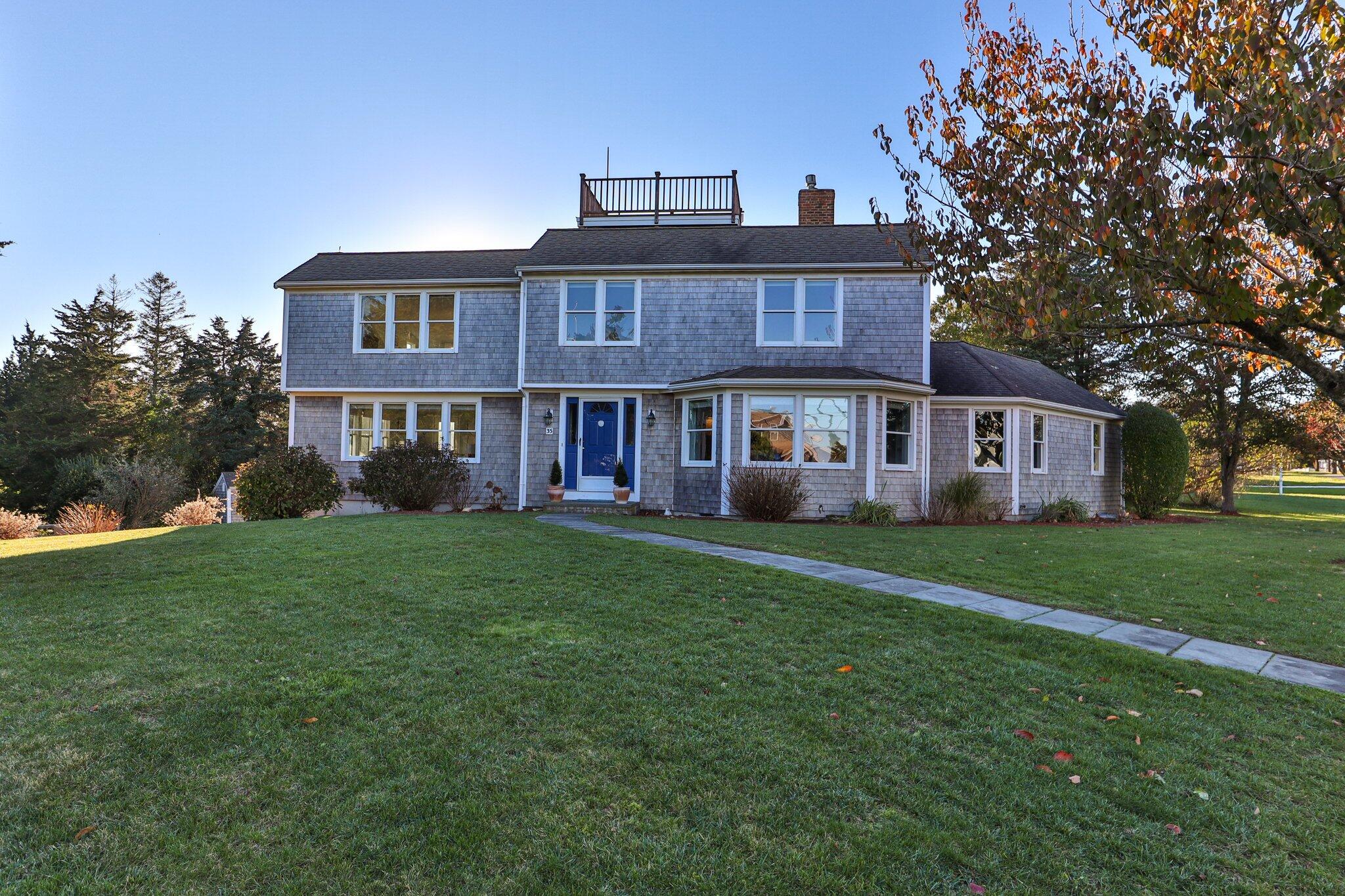 35 Mill Pond Road Orleans, MA 02653 - Photo 2 of 34 a view of a yard in front of a house with large trees