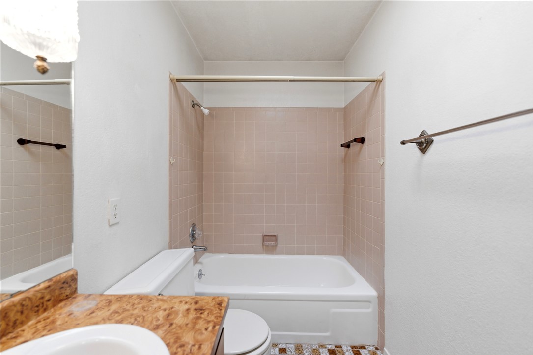 590 Ridgecrest Drive Kingman, AZ 86409 - Photo 16 of 33 a bathroom with a toilet and shower