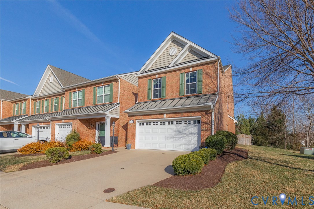 5221 Preston Square Loop Glen Allen, VA 23059 - Photo 1 of 30 a front view of a house with a yard and garage
