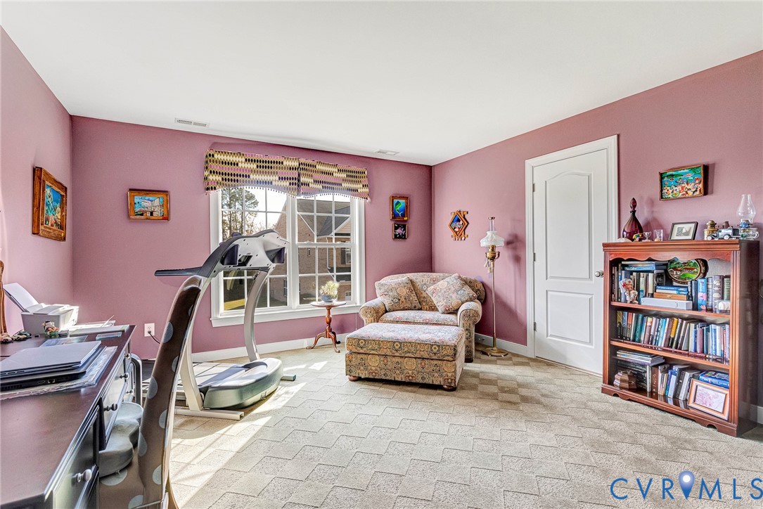 5221 Preston Square Loop Glen Allen, VA 23059 - Photo 11 of 30 a living room with furniture a bookshelf and a book shelf
