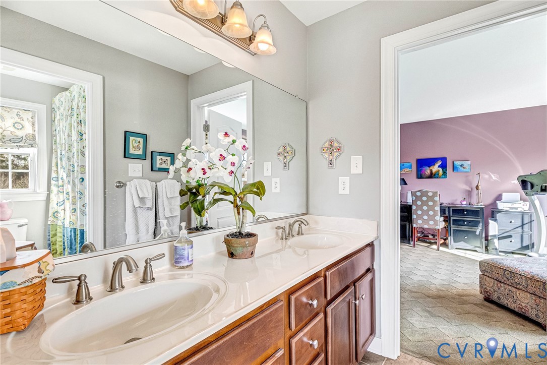 5221 Preston Square Loop Glen Allen, VA 23059 - Photo 15 of 30 a bathroom with a granite countertop sink a mirror and a shower
