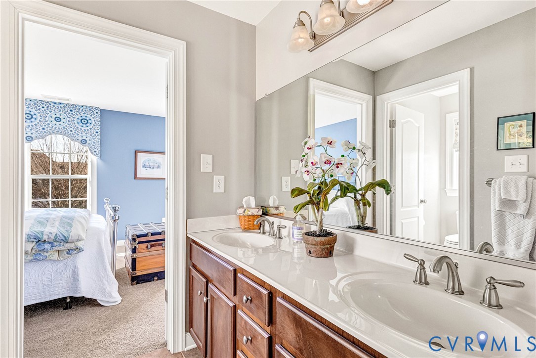 5221 Preston Square Loop Glen Allen, VA 23059 - Photo 16 of 30 a bathroom with a sink double vanity and a mirror