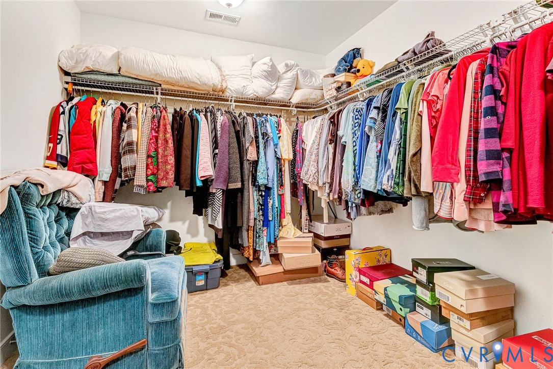 5221 Preston Square Loop Glen Allen, VA 23059 - Photo 24 of 30 a view of walk in closet with clothes and shoes