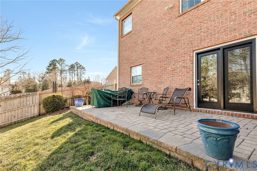 5221 Preston Square Loop Glen Allen, VA 23059 - Photo 27 of 30 a view of a patio with table and chairs and potted plants