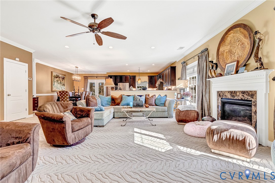 5221 Preston Square Loop Glen Allen, VA 23059 - Photo 8 of 30 a living room with furniture a fireplace and a large window