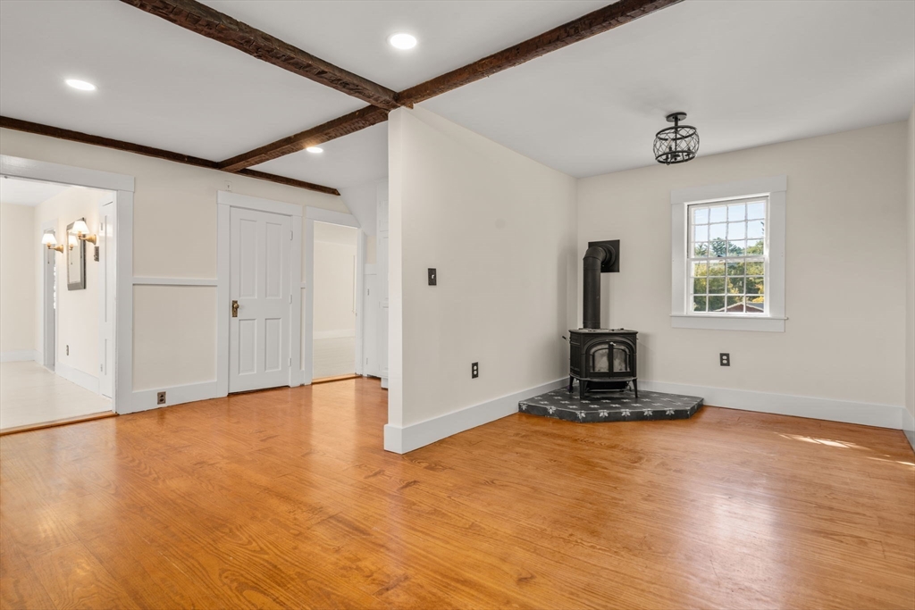 1011 Edmands Road Framingham, MA 01701 - Photo 11 of 36 a view of an empty room with wooden floor and a window