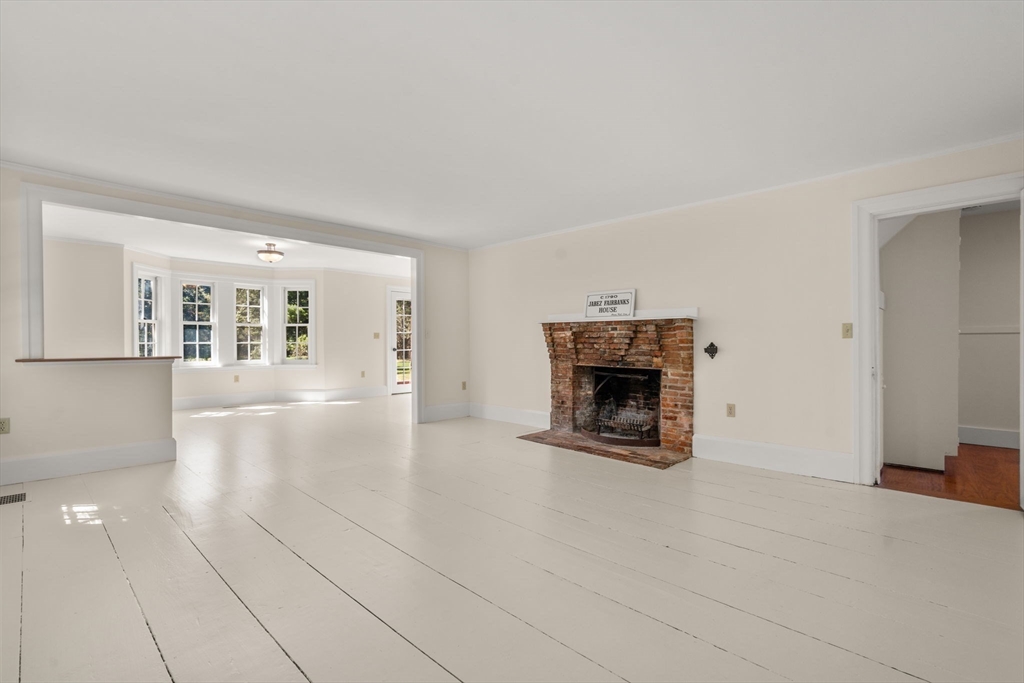 1011 Edmands Road Framingham, MA 01701 - Photo 21 of 36 a view of an empty room with a fireplace and a window