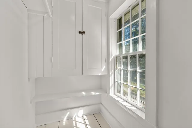 a view of empty room with windows