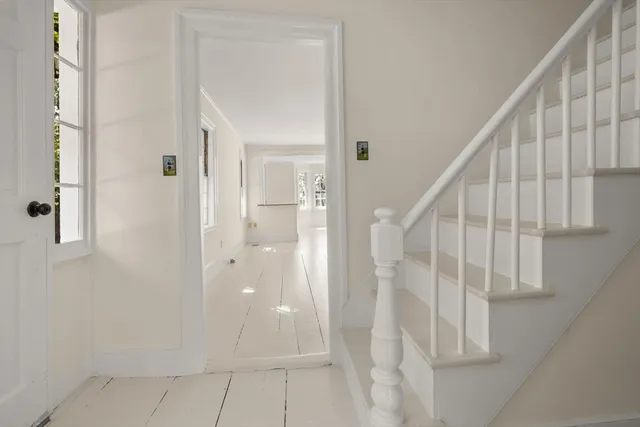 a view of entryway with wooden floor