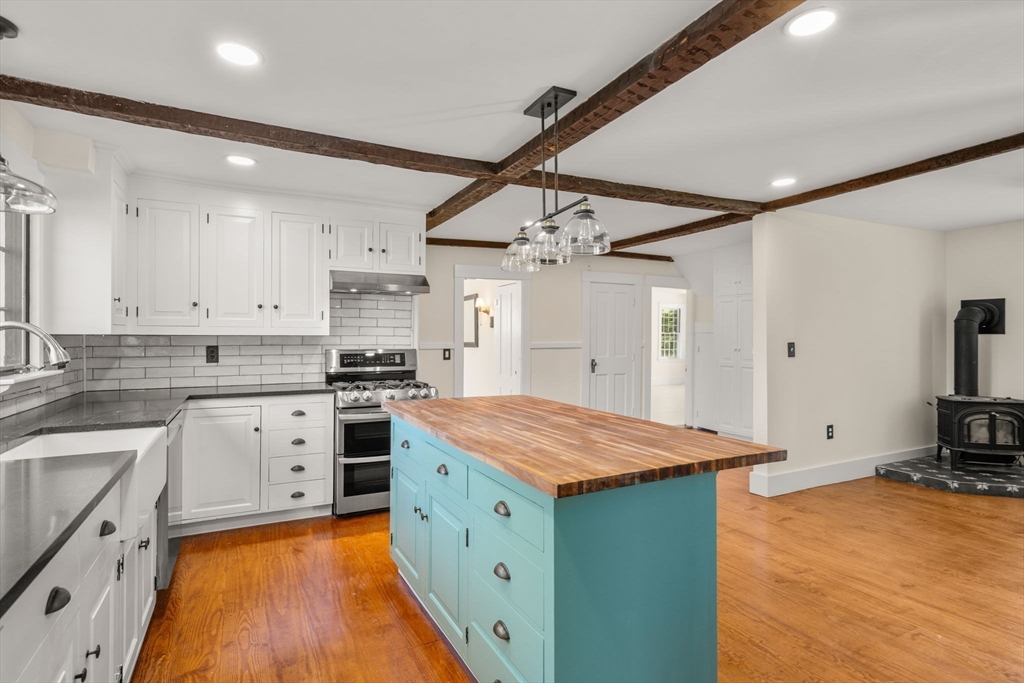 1011 Edmands Road Framingham, MA 01701 - Photo 8 of 36 a kitchen with a stove a sink and a refrigerator