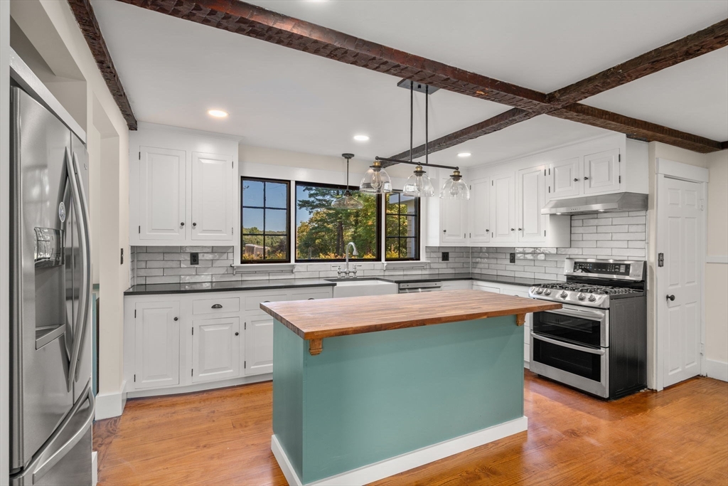 1011 Edmands Road Framingham, MA 01701 - Photo 9 of 36 a kitchen with stainless steel appliances granite countertop a sink and stove