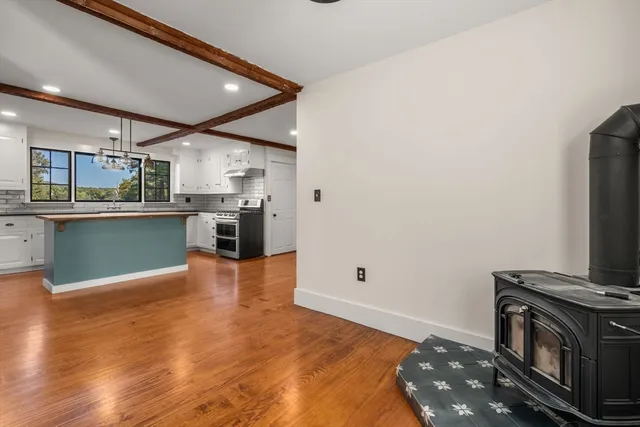 a kitchen with stainless steel appliances granite countertop a stove and a refrigerator